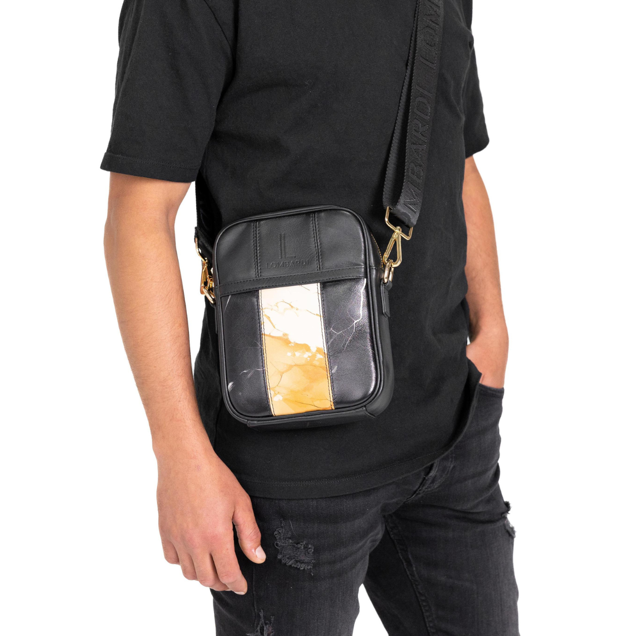 Heritage edition Black Premium leather bag with marble pattern being worn by a model in a black shirt